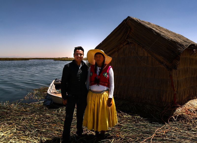 native woman living on a floating island in lake titicaca puno peru get in peru